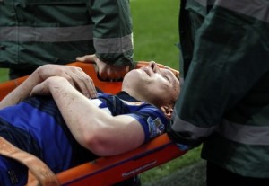 Manchester United's Jones is carried off the pitch on a stretcher during their English Premier League soccer match against Arsenal in London